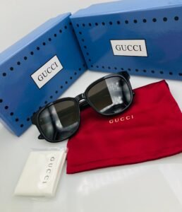 Gucci Rectangular Sunglasses for Men and Women, 001 Black/Gold, Polished Black Acetate Frame with Gold Interlocking G Logo, Solid Black UV400 Protection Lenses, Luxury Designer Eyewear