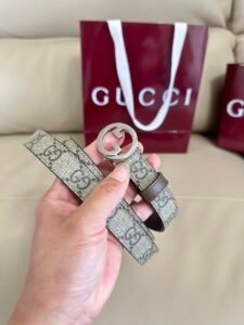 Gucci Thin GG Supreme Reversible Belt for Women, 001 Beige GG/Dark Brown Leather, Signature Monogram Canvas with Silver Interlocking G Buckle, 2cm Width, Luxury Designer Waist Belt